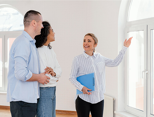 Cash home buyer viewing property with real estate agent